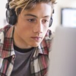 teen boy looking with headphones